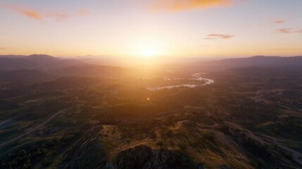 Obraz premium Golden hour sunset over a vast, rolling landscape with a meandering river, showcasing a serene and peaceful vista of mountains and valleys. : Generative AI