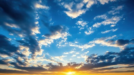 Fototapeta premium Dramatic sunset sky with vibrant orange and blue hues, featuring a mix of fluffy white clouds and darker storm clouds, creating a breathtaking natural scene. : Generative AI