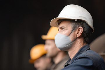 safe and healthy workplace environment showcasing workers wearing protective gear