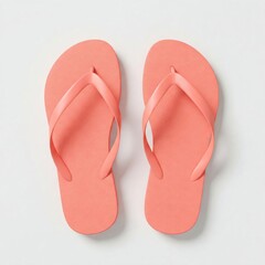 A pair of pink flip-flops placed side by side on a light background.