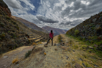 Obraz premium Ancient Inca Ruins of Pisac with Dramatic Mountain Landscape, Sacred Valley, Peru