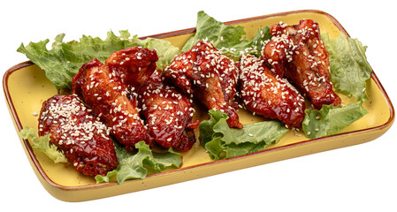 Cooked chicken wings in sauce and sesame seeds