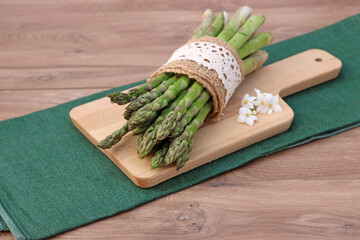 Green asparagus on a cutting board.