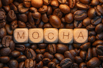 Mocha coffee beans and wooden letter blocks arrangement