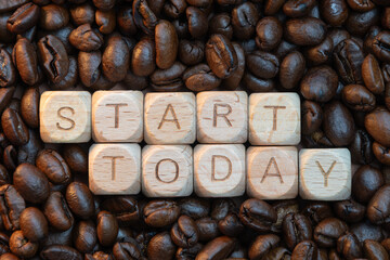 Start today message on wooden blocks surrounded by coffee beans