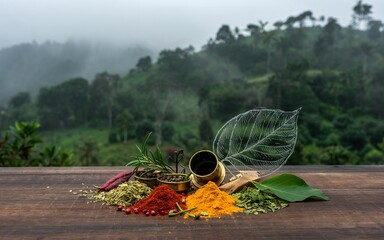 Spring, Wayanad, Kerala ,Hills, herbs, early monsoon mist, india, Spices on Wooden Table, Misty Mountain Background