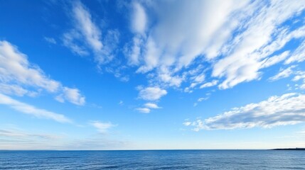 Obraz premium Serene seascape showcasing a vast expanse of blue ocean under a vibrant sky filled with fluffy white cumulus clouds. : Generative AI