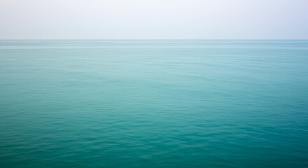 Obraz premium Cool ocean breeze gradient transitioning from light teal to deep turquoise gradient wallpaper background