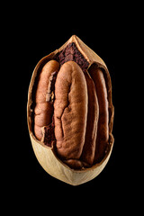 One cracked pecan nut isolated on black background.