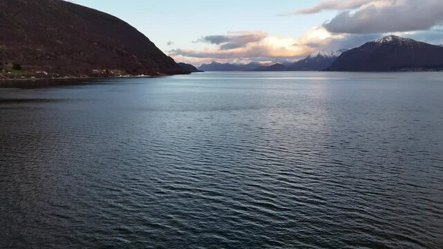 Sulafjorden's calm water between the islands of Hareid and Sula, near Aalesund, Norway at dusk