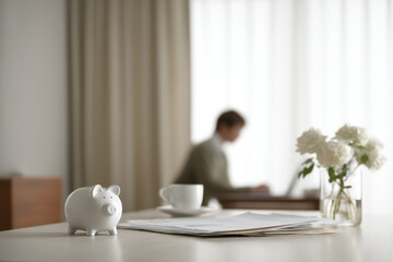 serene home office setting with person planning their savings surrounded by financial documents and laptop