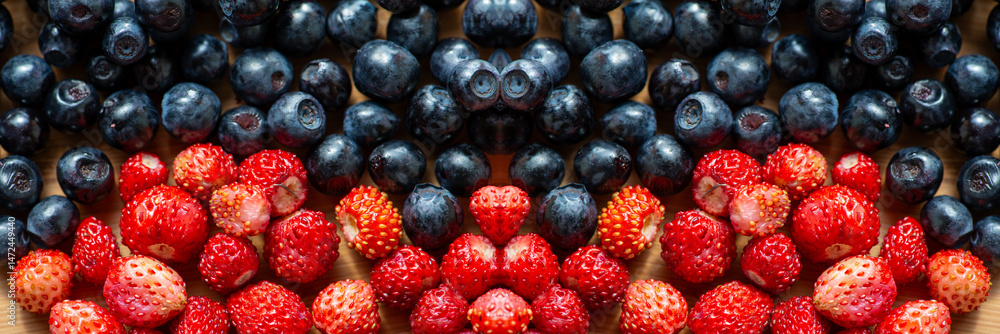 Poster bright berries create a vibrant display of color and texture on rustic wood