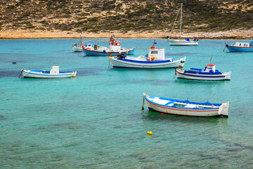 Obraz premium Boats moored in the bay of Kalotaritissa Beach. Amorgos, Cyclades, Greece