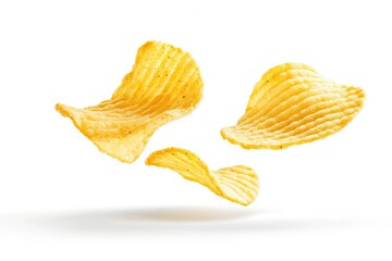 Crispy potato chips in mid-air, against a plain white background.  Golden yellow, wavy chips
