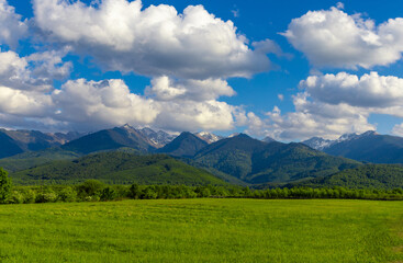 Fototapeta premium Landscape with the Fagaras Mountains in Romania seen from a distance in spring