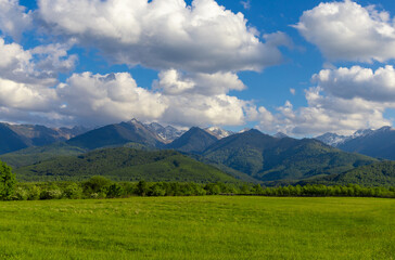 Fototapeta premium Landscape with the Fagaras Mountains in Romania seen from a distance