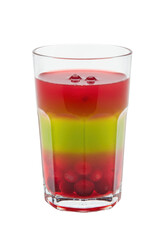 Colorful drink in glass with red berries, layered green and red beverage. Sweet and refreshing