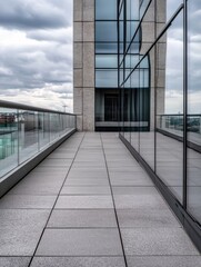 Modern building exterior, showcasing a sleek grey granite tiled terrace with glass railings and a reflective glass facade under a cloudy sky. : Generative AI