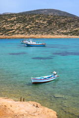 Boats moored in the bay of Kalotaritissa Beach. Amorgos, Cyclades, Greece