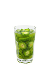 Glass of vibrant green bitter melon slices in water. Refreshing drink. Summer beverage