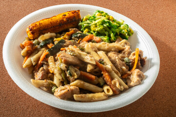 Penne pasta dish with chicken and banana