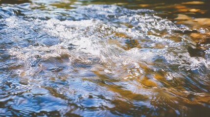 Fototapeta premium Rippled Water Surface with Sunlight Reflections in Natural Setting