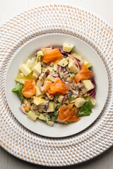 Waldorf salad with delicious smoked salmon, apple, raisins, walnuts, and mayonnaise dressing.