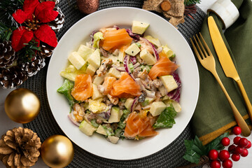 Waldorf salad with delicious smoked salmon, apple, raisins, walnuts, and mayonnaise dressing.