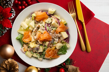 Waldorf salad with delicious smoked salmon, apple, raisins, walnuts, and mayonnaise dressing.