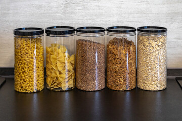 Organized kitchen storage with clear containers for food