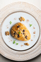 Triangular English scones with dark chocolate chips. Top view table with christmas decorations.