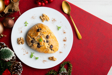 Triangular English scones with dark chocolate chips. Top view table with christmas decorations.