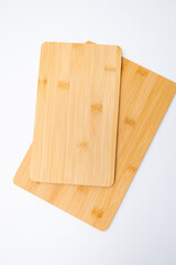 Brown Orange Texture of stained oak wood cutting board with grain on white background, fragment of a wooden panel hardwood. Space for text. Rustic countertop of timber surface