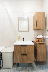 Modern Home Bathroom Interior With Wooden Vanity and Floral Decor Elements