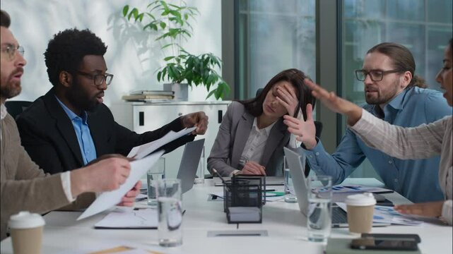 Overworked stressed team leader boss suffer head ache headache migraine multicultural workers businesspeople business women men employees argue shout conflict scream health problem paperwork office