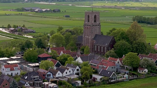 Aerial View of Ransdorp, idyllic Dutch Village in North Holland with Historic Church Surrounded by Farmland