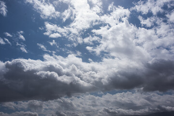 grey clouds in a blue sky