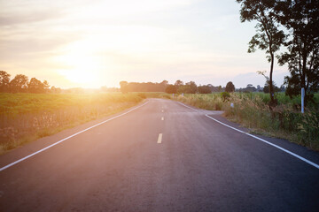 Road Leading Into A Sunset