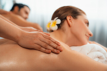 Caucasian couple customer enjoying relaxing anti-stress spa massage and pampering with beauty skin...