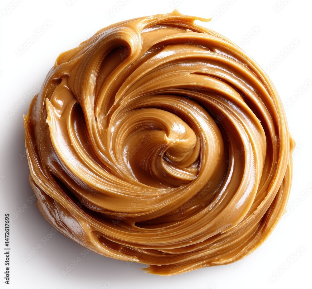 Poster creamy smooth peanut butter swirled in a round pattern with a glossy finish, showcasing its rich tex