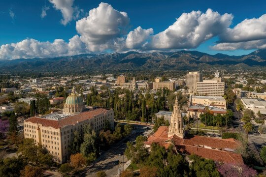 Vibrant Aerial Panorama of Pasadena, California: Urban Landscape with Purple Trees, Cloudy Skies, and Majestic Mountains
