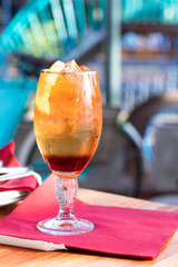 Close up of cold glass of steelworks cocktail / coctail in a glass outdoors