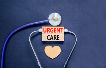 Urgent care symbol. Concept words Urgent care on beautiful wooden blocks. Wooden heart and...