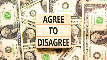 Agree to disagree symbol. Concept words Agree to disagree on beautiful wooden blocks. Dollar bills....