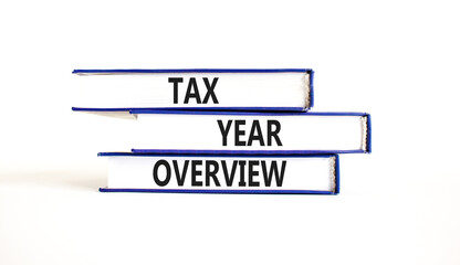 Tax year overview symbol. Concept words Tax year overview on beautiful blue white books. Beautiful white background. Business tax year overview concept. Copy space.