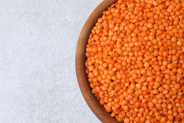 Red lentils on a gray background
