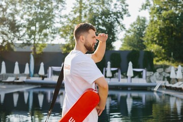 Lifeguard watching over the pool on a sunny day