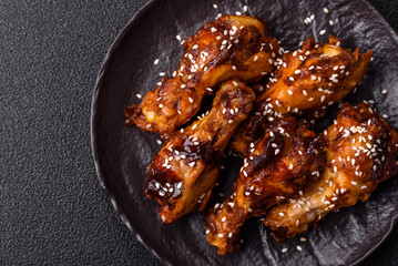 Grilled chicken wings in teriyaki sauce. Hot spicy takeaway food