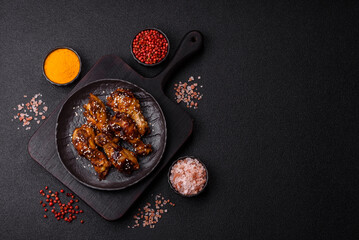 Grilled chicken wings in teriyaki sauce. Hot spicy takeaway food