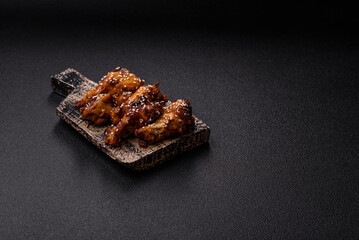 Grilled chicken wings in teriyaki sauce. Hot spicy takeaway food